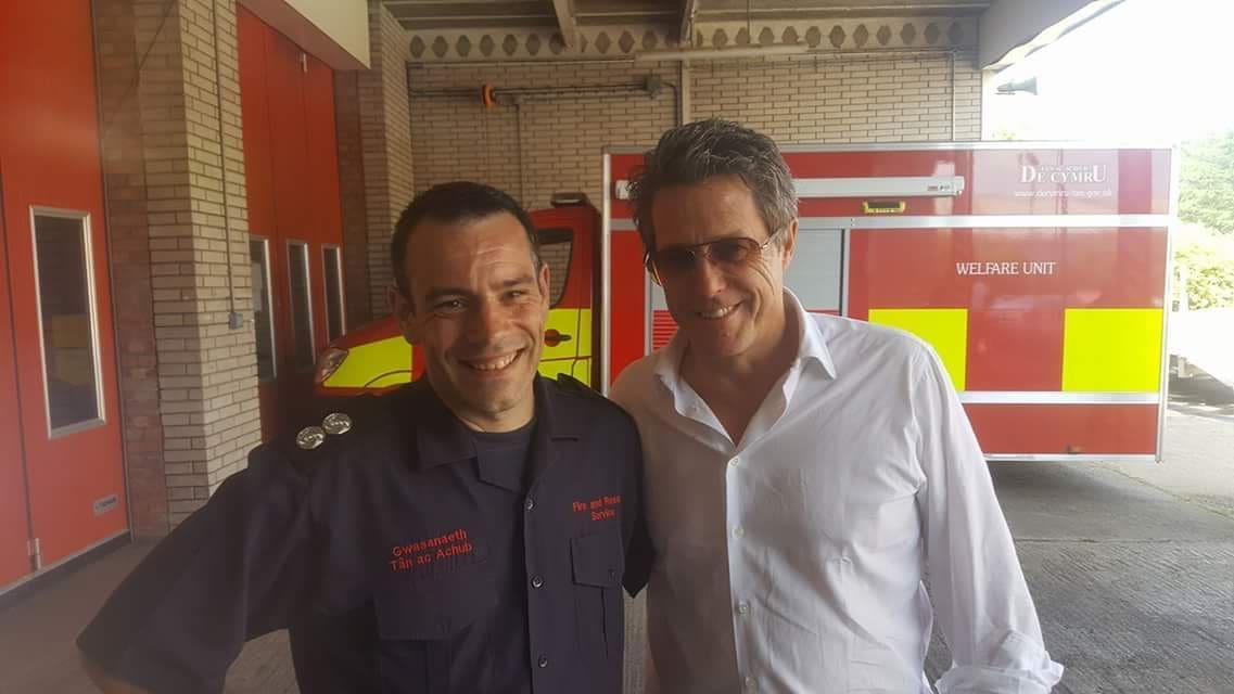 Tony O'Neill with Hugh Grant at Tonypandy Fire Station, South Wales Fire and Rescue Service