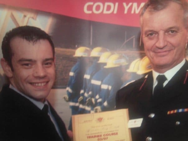 Tony O'Neill receiving his passing out certificate from Assistant Chief Fire Officer Andy Marles at South Wales Fire and Rescue Service Training Centre, Cardiff Gate, November 2007